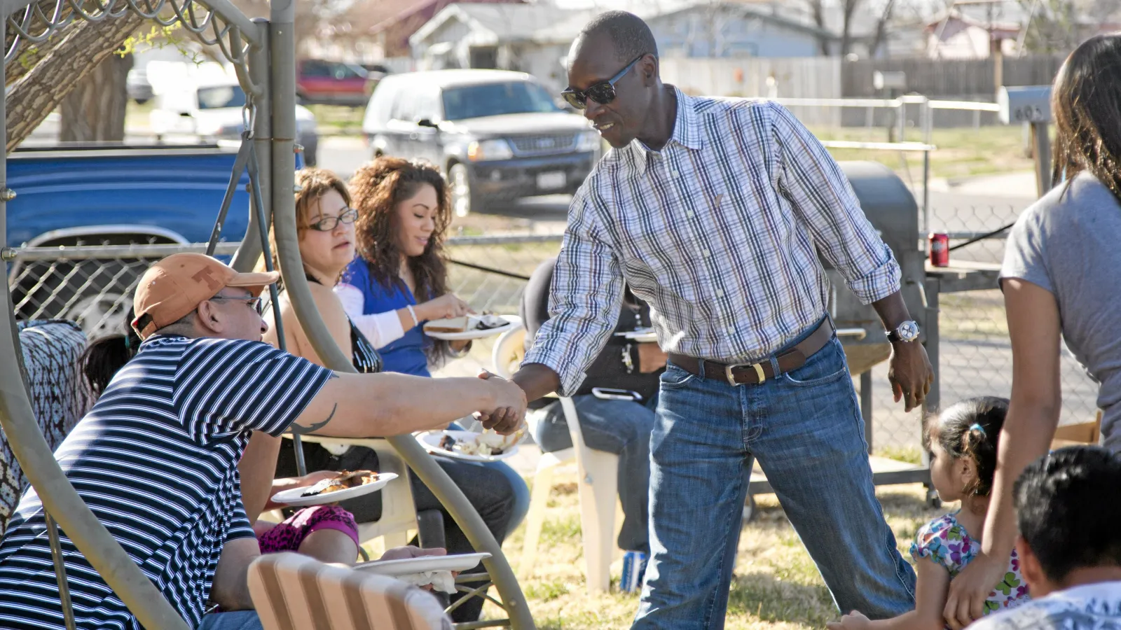 Don Cheadle meeting families affected by climate change in Texas