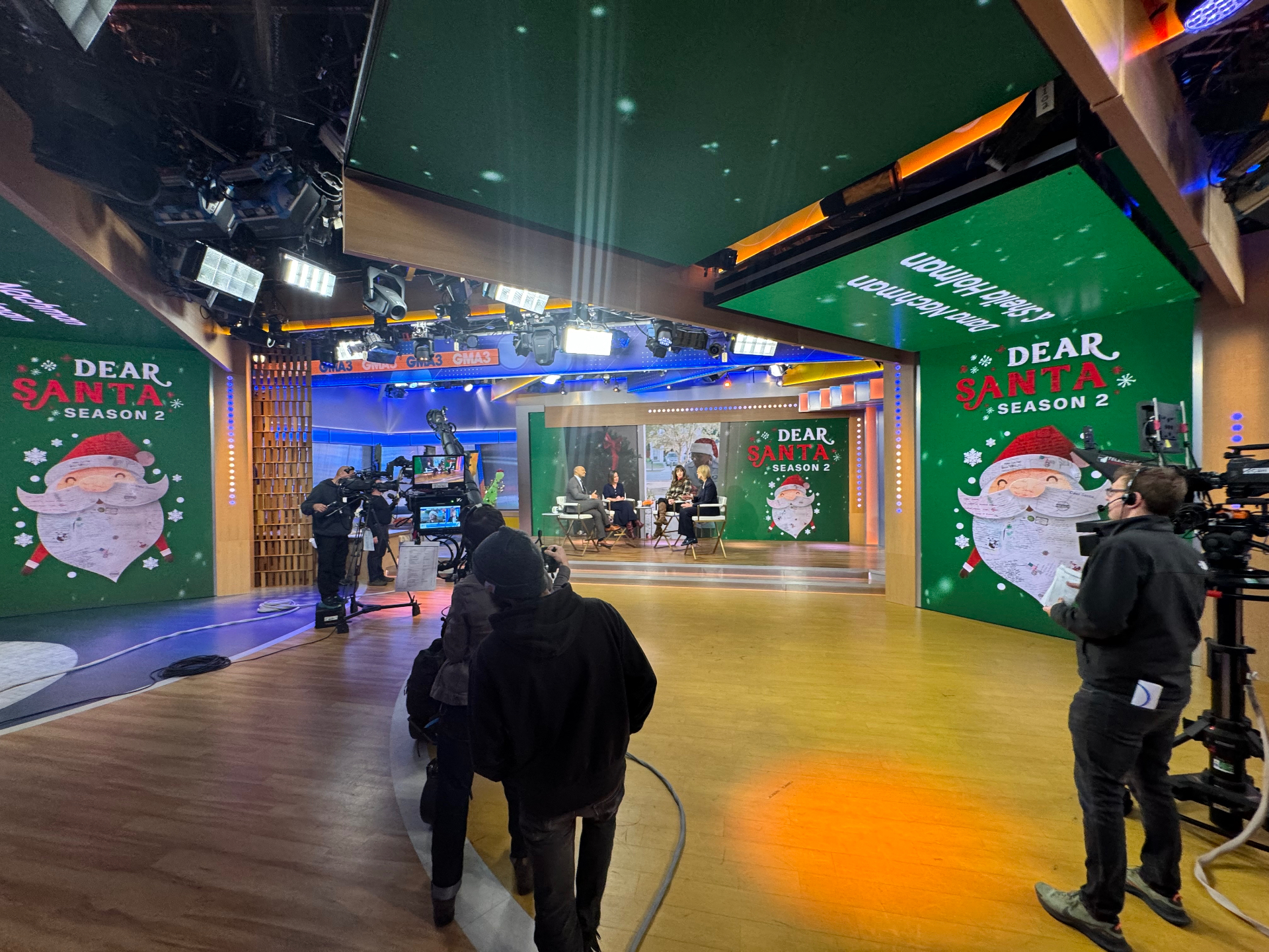 Wide view of a Dear Santa Season 2 television segment taping inside a national broadcast studio.