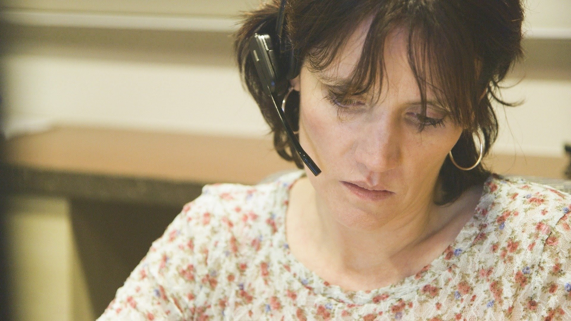 A Veterans Crisis Line responder listens during a call with a veteran in crisis