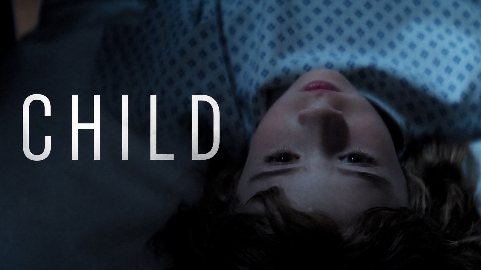 Child — two men seated in a dark vehicle at night, the film's title beside them